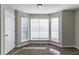 Bright dining area with bay window and wood-look flooring at 5910 Rock Rd, Union City, GA 30291