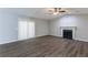 Spacious living room featuring a fireplace, vaulted ceiling, and ceiling fan at 5910 Rock Rd, Union City, GA 30291