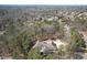 A distant view of the home surrounded by dense trees within a neighborhood at 2727 Jamerson Rd, Marietta, GA 30066