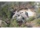 A high angle view of the home showing the roof, driveway and surrounding trees at 2727 Jamerson Rd, Marietta, GA 30066