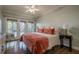 Bright bedroom with a king-size bed and access to a deck at 2727 Jamerson Rd, Marietta, GA 30066