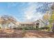Gray two-story house with a wrap-around porch and stone accents at 2727 Jamerson Rd, Marietta, GA 30066