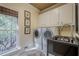 Bright laundry room with washer, dryer, and a sink at 2727 Jamerson Rd, Marietta, GA 30066