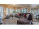 Spacious living room featuring a comfortable sectional sofa and large windows at 2727 Jamerson Rd, Marietta, GA 30066