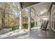 Spacious front porch with rocking chairs and view of wooded area at 2727 Jamerson Rd, Marietta, GA 30066