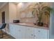 Convenient wet bar with white cabinets and granite countertop at 2727 Jamerson Rd, Marietta, GA 30066