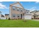 Two-story house with brick and siding, gray shutters, and a two-car garage at 340 Paulownia Cir, Mcdonough, GA 30253