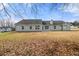 A wide view of backyard and the home's rear exterior elevation at 85 Blue Jay Dr, Covington, GA 30016