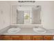 Bathroom featuring a double vanity, and large mirror at 85 Blue Jay Dr, Covington, GA 30016