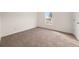 Spacious carpeted bedroom with neutral color at 85 Blue Jay Dr, Covington, GA 30016