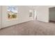 Spacious carpeted bedroom with plenty of natural light at 85 Blue Jay Dr, Covington, GA 30016