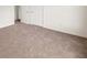 Carpeted bedroom with white walls and double door closet at 85 Blue Jay Dr, Covington, GA 30016