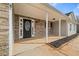 Inviting front porch with stone accents and a stylish front door at 85 Blue Jay Dr, Covington, GA 30016