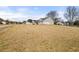 Wide view of front yard and home's exterior elevation at 85 Blue Jay Dr, Covington, GA 30016