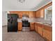 Cozy kitchen featuring wooden cabinets and stainless steel appliances at 85 Blue Jay Dr, Covington, GA 30016