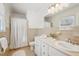 Bathroom with white vanity, beige tile and shower/tub combo at 2773 Townley Cir, Atlanta, GA 30340