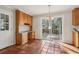 Breakfast room with terracotta tile floor, built-in desk, and access to deck at 2773 Townley Cir, Atlanta, GA 30340