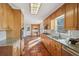 Open kitchen with granite counters, stainless steel appliances, and terracotta floors at 2773 Townley Cir, Atlanta, GA 30340