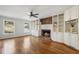 Spacious living room with hardwood floors, fireplace, and built-in shelving at 2773 Townley Cir, Atlanta, GA 30340