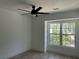 Bright bedroom with ceiling fan and large window at 429 Grant Se St, Atlanta, GA 30312