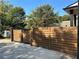 Modern wood and metal gate with a concrete driveway at 429 Grant Se St, Atlanta, GA 30312