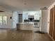 Modern kitchen with white cabinets, large island, and dark backsplash at 429 Grant Se St, Atlanta, GA 30312