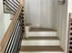 Modern staircase with light oak wood and black metal railing at 429 Grant Se St, Atlanta, GA 30312