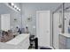 Bathroom featuring a modern sink vanity, with walk-in glass shower at 625 Piping Rock Pt, Lawrenceville, GA 30043