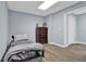 Cozy bedroom featuring wood floors, and a dresser for storing your belongings at 625 Piping Rock Pt, Lawrenceville, GA 30043