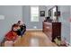 Bedroom featuring hardwood floors, a dresser and neutral paint at 625 Piping Rock Pt, Lawrenceville, GA 30043