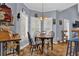 Cozy breakfast nook with a charming chandelier and natural light at 625 Piping Rock Pt, Lawrenceville, GA 30043