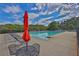 Sparkling community pool with lounge chairs and shade umbrellas for residents' relaxation at 625 Piping Rock Pt, Lawrenceville, GA 30043