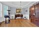 Bright dining room featuring hardwood floors, chandelier, and bay window offering natural light at 625 Piping Rock Pt, Lawrenceville, GA 30043