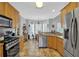 Open kitchen featuring stainless steel appliances and a breakfast nook at 625 Piping Rock Pt, Lawrenceville, GA 30043
