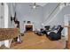 Spacious living room with vaulted ceiling, hardwood floors, fireplace, and abundant natural light at 625 Piping Rock Pt, Lawrenceville, GA 30043