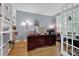 Bright office with hardwood floors, built-in shelving, and French doors, perfect for working from home at 625 Piping Rock Pt, Lawrenceville, GA 30043
