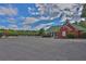 Community pool and clubhouse with ample parking and landscaped surroundings at 625 Piping Rock Pt, Lawrenceville, GA 30043