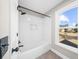 Bathroom with white subway tile shower and a built-in window at 714 Settlers Xing, Canton, GA 30114