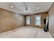 Spacious bedroom with carpeted floor, large windows, and ceiling fan at 1425 Landings Chase, Alpharetta, GA 30005