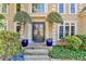 Elegant double front doors with sidelights, stone steps and blue planters at 1425 Landings Chase, Alpharetta, GA 30005