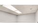 A clean and unfinished basement space, with new lighting and neutral gray walls at 2170 Charleston Pl, Lithia Springs, GA 30122