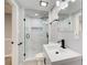 Stylish bathroom featuring a glass shower with gray tile accents and modern black fixtures at 2170 Charleston Pl, Lithia Springs, GA 30122