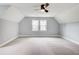 A spacious bedroom with a vaulted ceiling, plush carpeting, and windows that flood the room with natural light at 2170 Charleston Pl, Lithia Springs, GA 30122