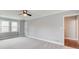 Bright bedroom with neutral walls, carpeted floor, and a ceiling fan at 2170 Charleston Pl, Lithia Springs, GA 30122