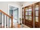 Charming foyer with hardwood floors, a staircase, and a wood front door at 2170 Charleston Pl, Lithia Springs, GA 30122