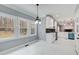 Charming kitchen nook with white marble floors and a large window showcasing a view of the wooded landscape at 2170 Charleston Pl, Lithia Springs, GA 30122