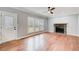 Bright living room featuring a fireplace and hardwood flooring at 2170 Charleston Pl, Lithia Springs, GA 30122