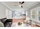 Open concept living room with hardwood floors, modern furniture, and view of the kitchen at 2170 Charleston Pl, Lithia Springs, GA 30122