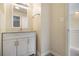 Small bathroom with vanity, mirror, and toilet at 257 Country Club Dr, Jonesboro, GA 30238