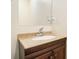 Bathroom featuring a light granite countertop over a dark wood cabinet at 257 Country Club Dr, Jonesboro, GA 30238